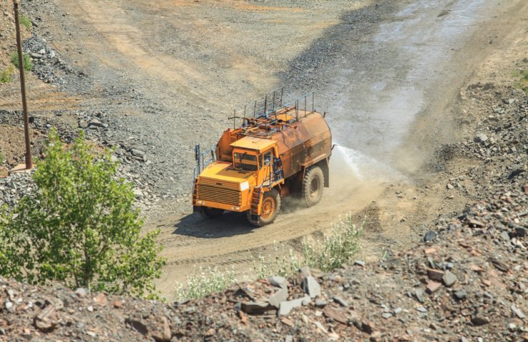 The road at Central GOK, Metinvest watering 14 BelAZ and MAZ
